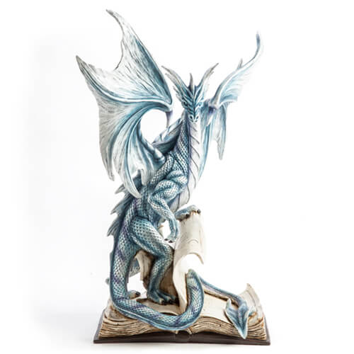 Large Blue Dragon Standing On An Open Ancient Book